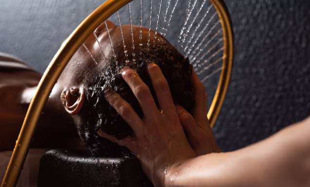 A woman getting a Japanese head spa treatment