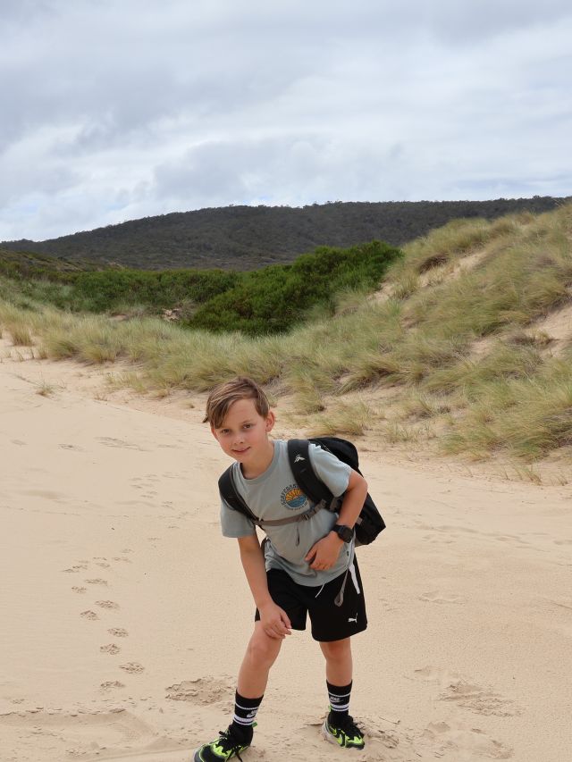 Lewis hiking with his pack for the first day