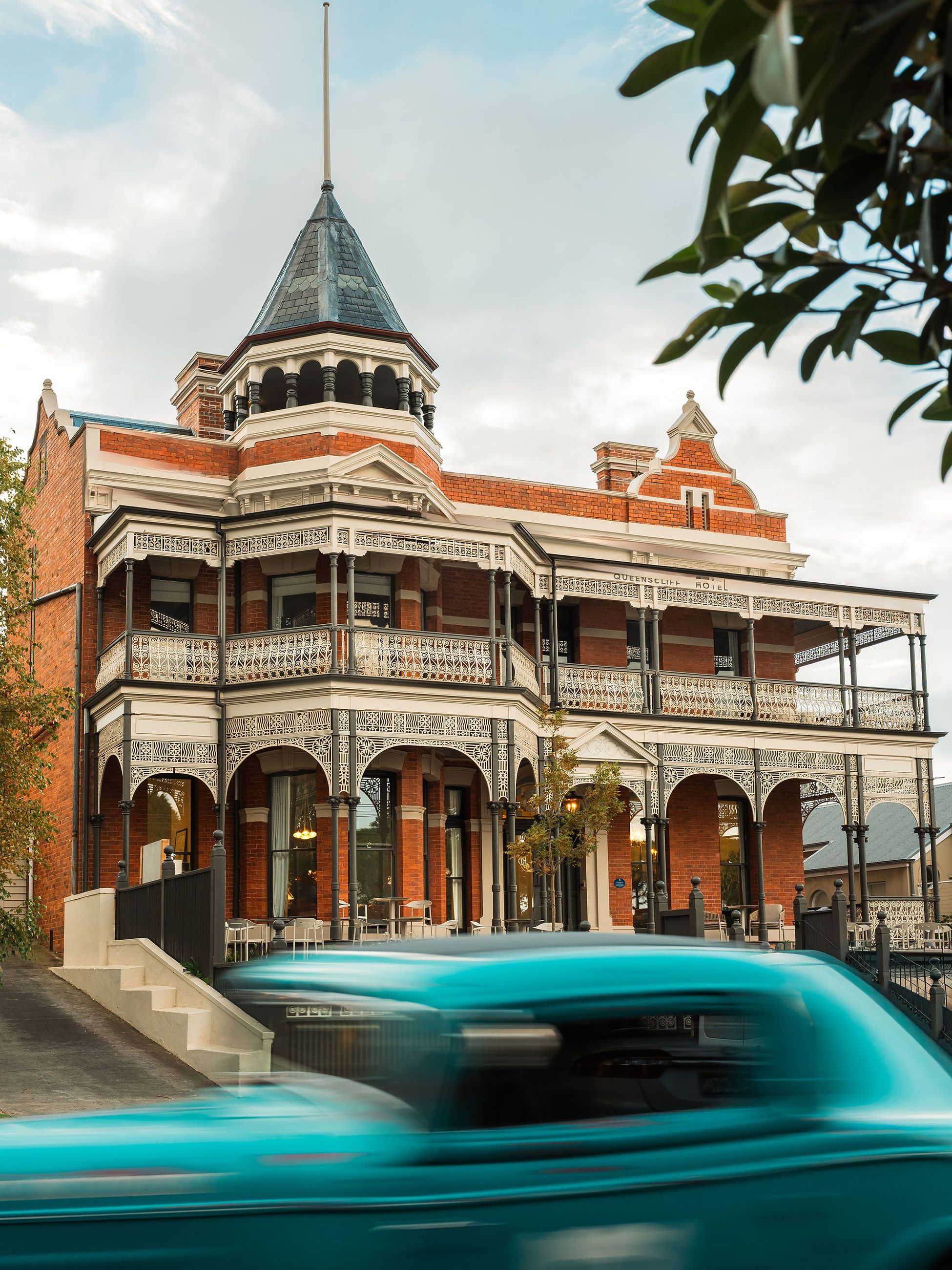 Exterior of The Queenscliff Hotel in Victoria with car driving past