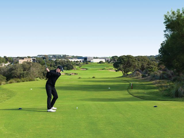 A quiet moment on the green as he prepares for the perfect swing.