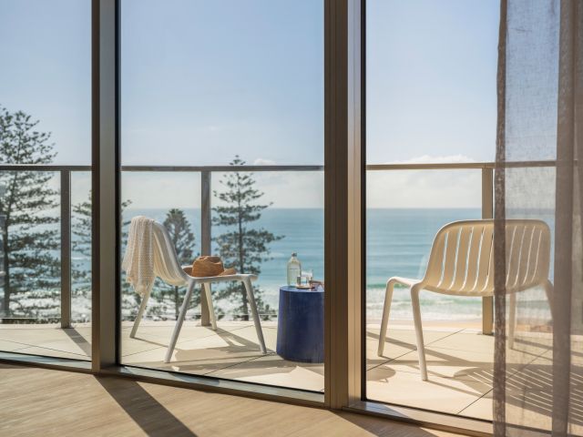 The balcony dining set and views at Avani Mooloolaba Beach Hotel