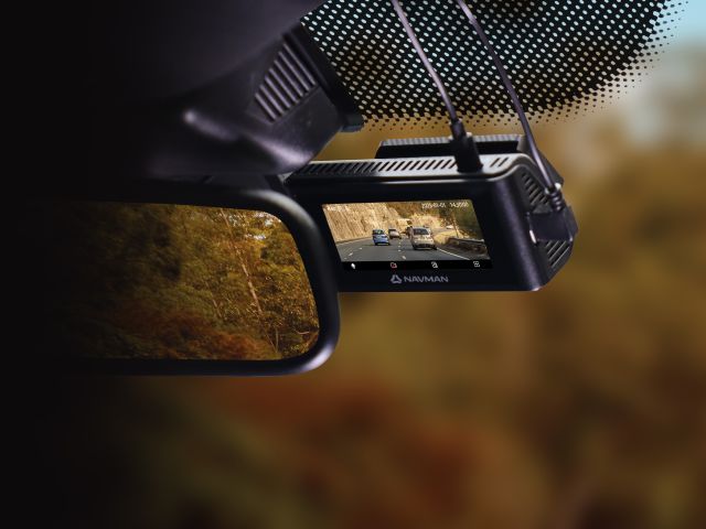 Dashcam recording road on dashboard