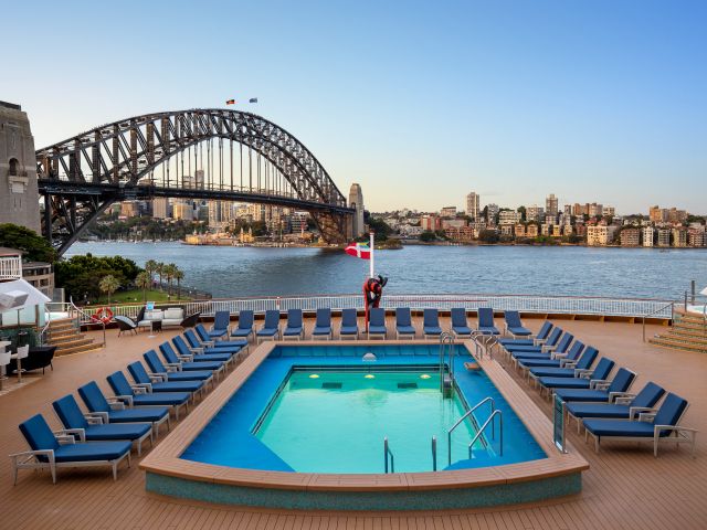 The pool on Norwegian Spirit with stunning views of the Sydney Harbour Bridge.