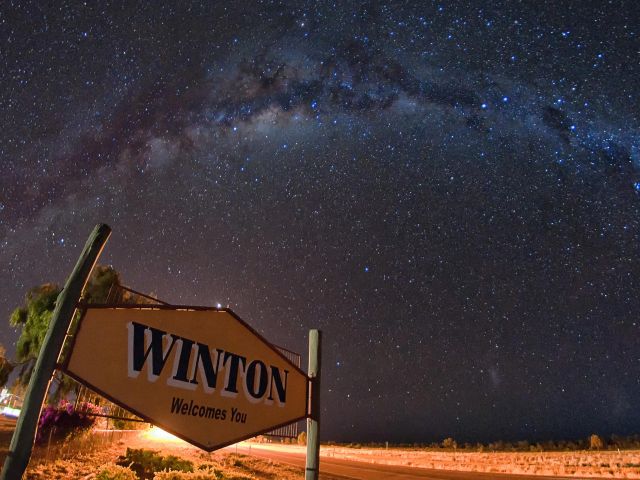 the milky way over winton's welcome sign in queensland