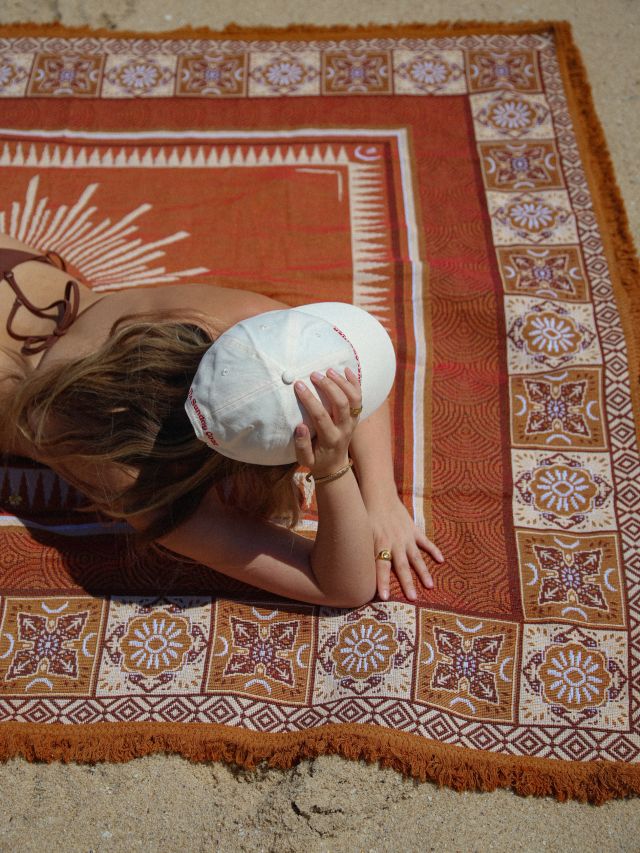 Gril laying on Eclipse rug from Sunday Coast