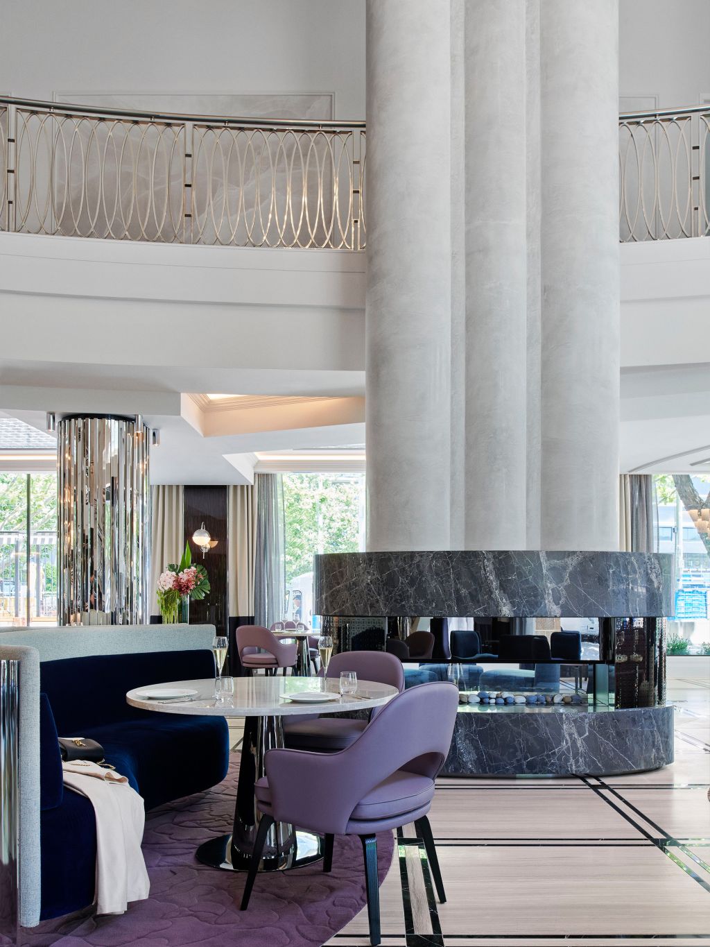 A large marble fireplace in the bar area of The Royce hotel