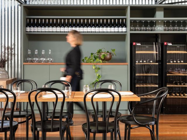 A stroll through Austin’s Wines, lined with bottles and warm dining spaces.