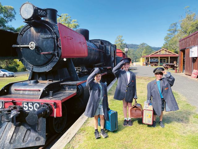 Children in dress up beside the Noojee Steam Train