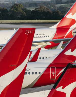 Qantas planes sitting together at airport