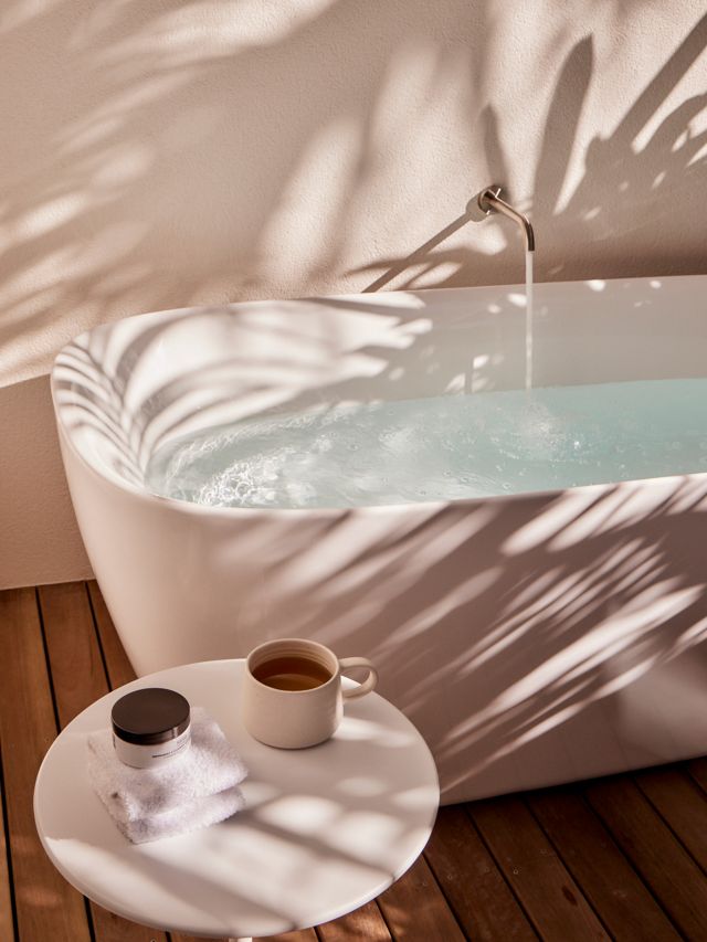A bathtub being filled at Hide Byron Bay