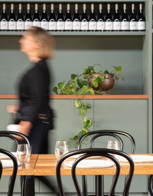 A stroll through Austin’s Wines, lined with bottles and warm dining spaces.