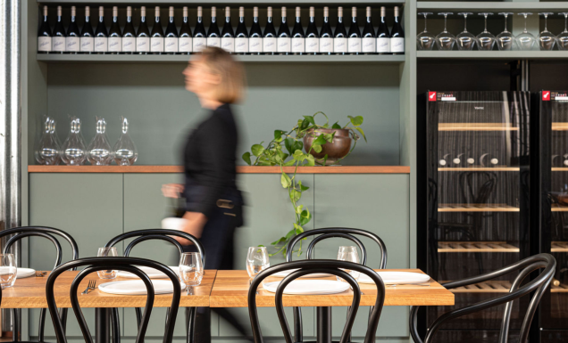 A stroll through Austin’s Wines, lined with bottles and warm dining spaces.