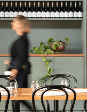 A stroll through Austin’s Wines, lined with bottles and warm dining spaces.