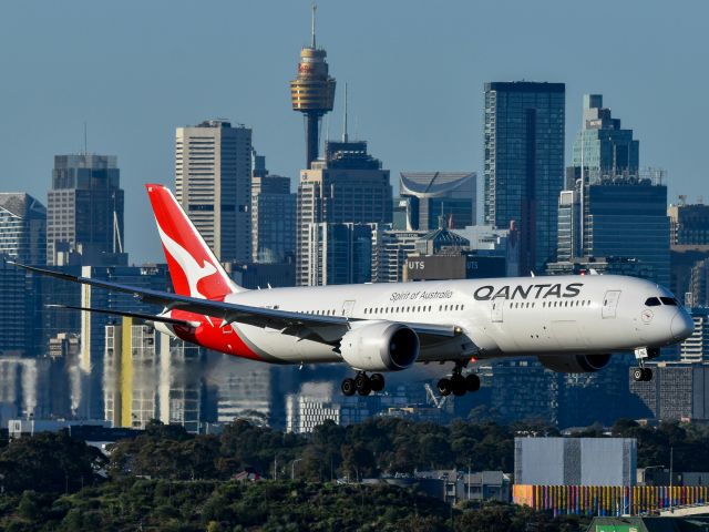 Qantas plane flying over Sydney CBD