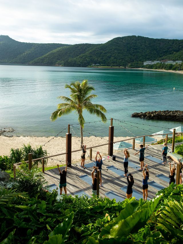 sunrise yoga session at the sundays on hamilton island wellness experiences