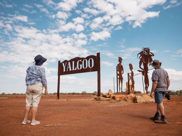 Visitors at the sign marking Yalgoo town