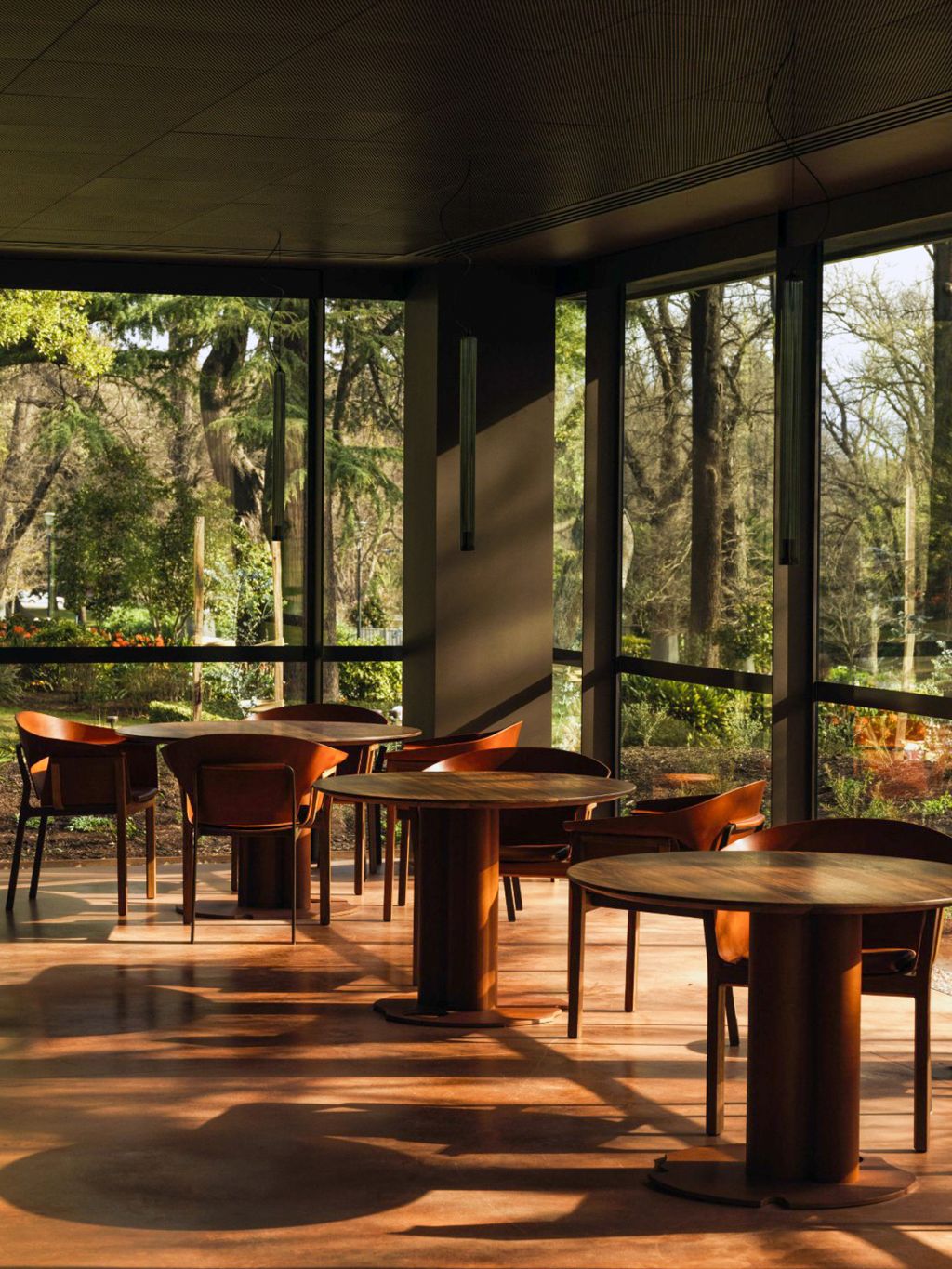 Tables by floor-to-ceiling windows at Yiaga, Melbourne