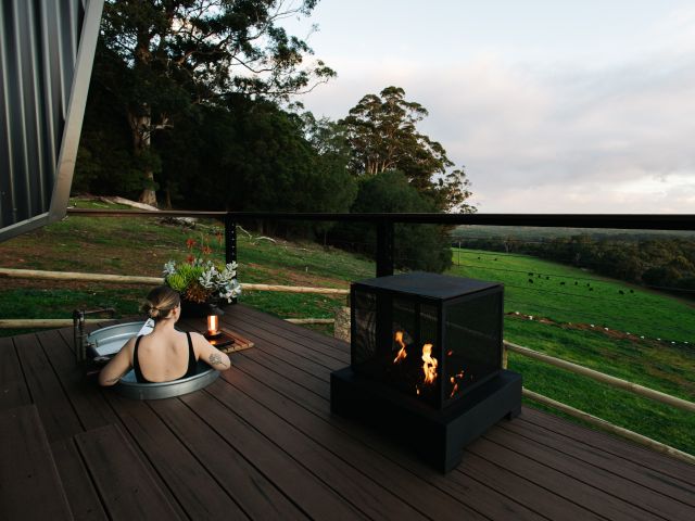 Guest in outdoor bath enjoying view