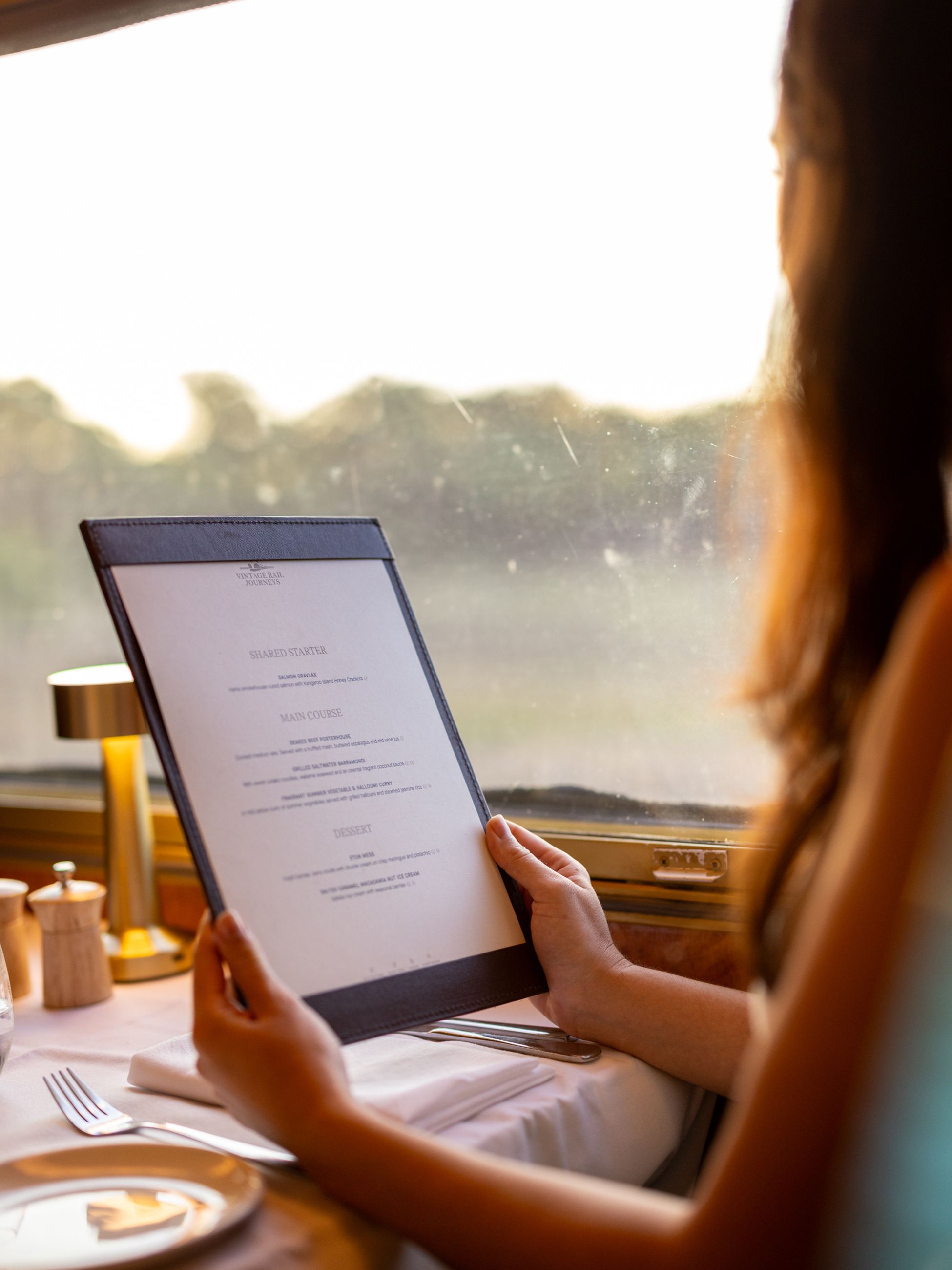 Reading the menu at Art Deco-style Queen