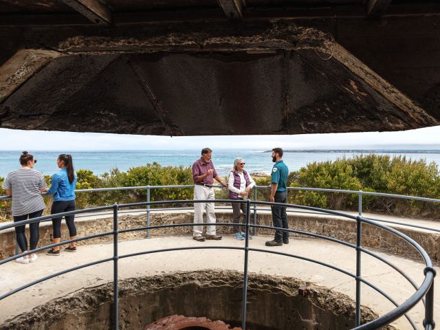 visitors and parks guide looking out from fort nepean
