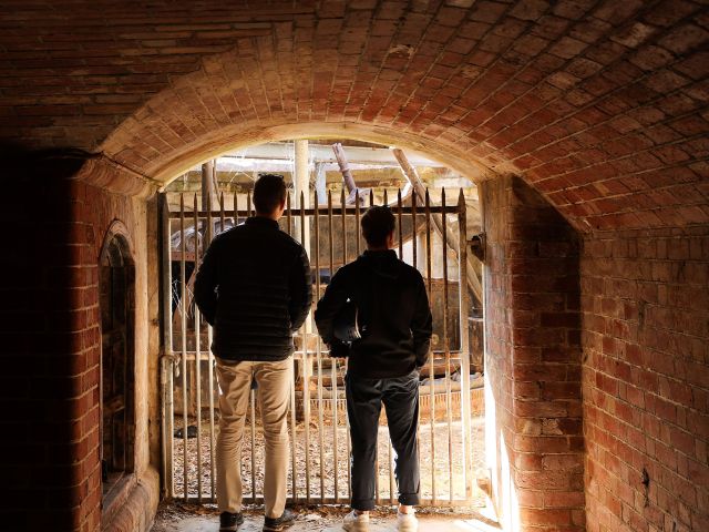 two walkers inside Fort Nepean Tunnels