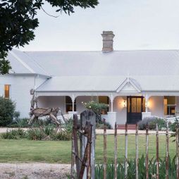 The historic white facade and garden of Littlebourne