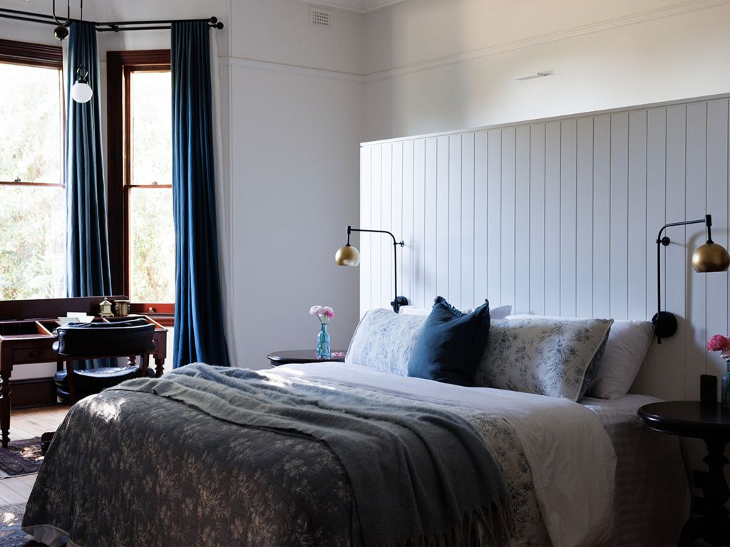 An antique-style bedroom within Littlebourne Guest House