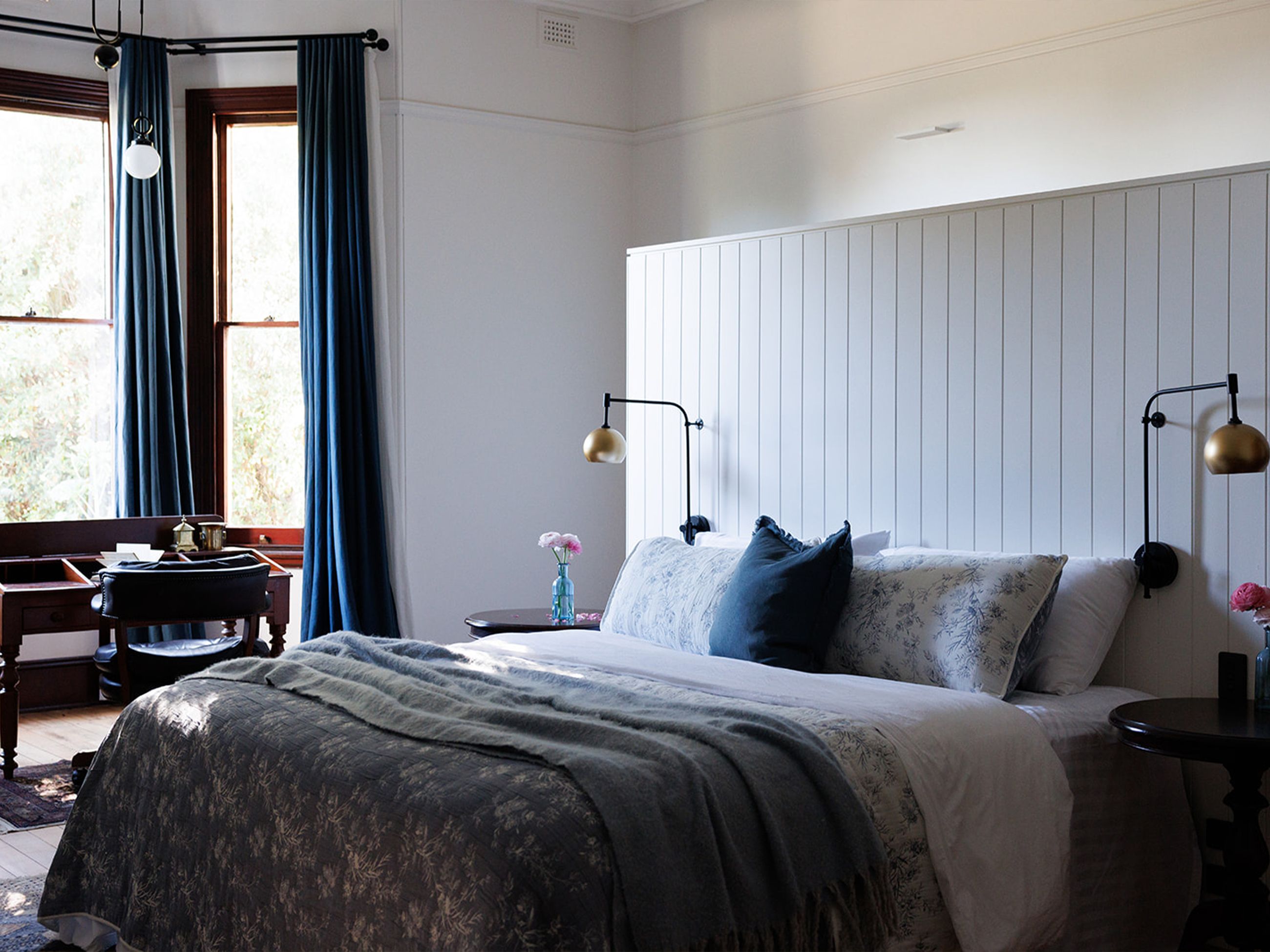 An antique-style bedroom within Littlebourne Guest House