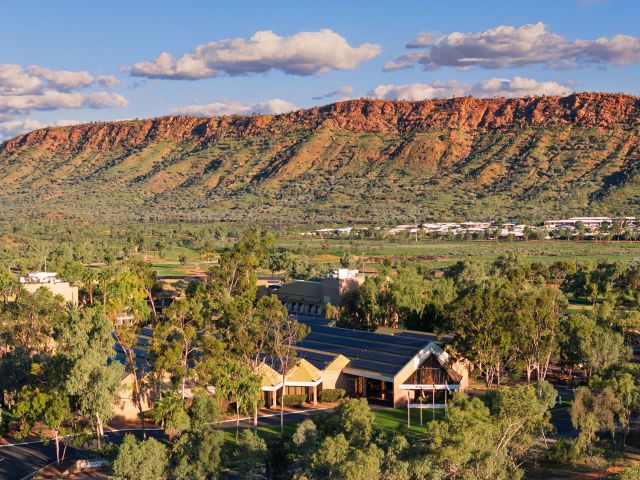 DoubleTree by Hilton Alice Springs framed by the rugged MacDonnell Ranges.