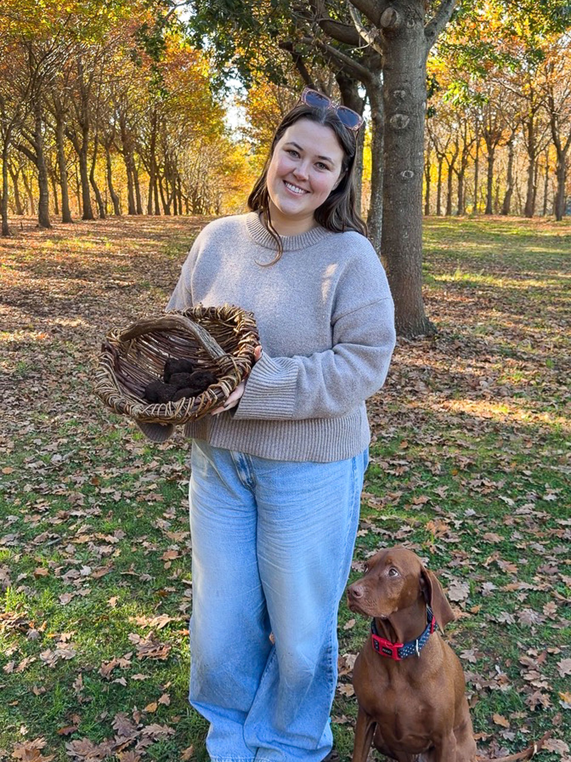 Emily Murphy and George the truffle hunting dog with basket of truffles at The Truffle Farm, Tasmania