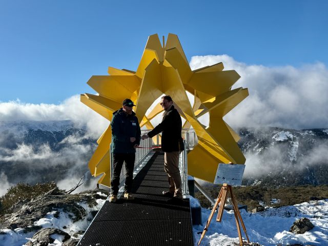 Falls Creek Resort’s Fred Weir and artist Giovanni Veronesi at the ribbon cutting ceremony of Alpine Sun
