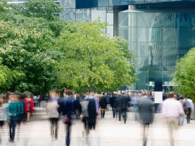 People moving through a busy city