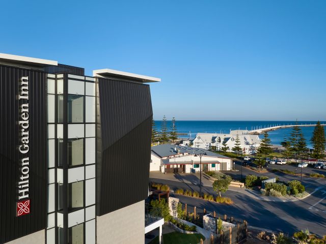 Hilton Garden Inn Busselton set against the sea.