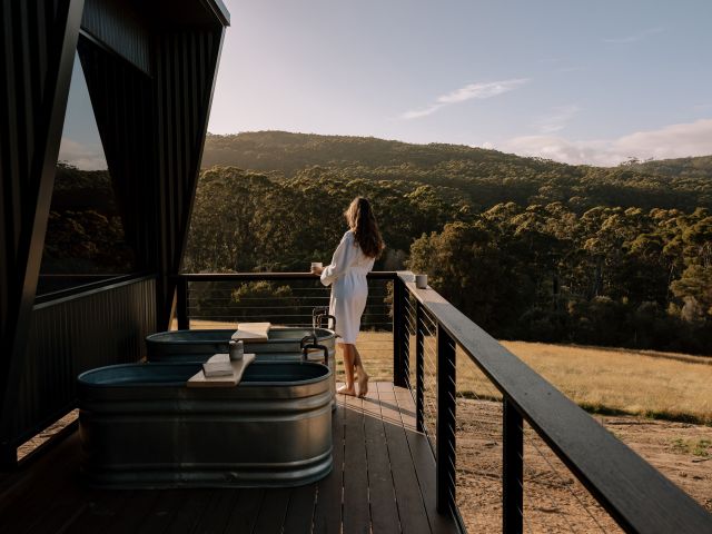 women on front deck at inside a cabin at heyscape denmar Western australia