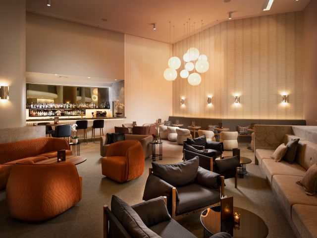 The classic lounge interiors of Palm Court Bar & Lounge at Hilton Darwin.