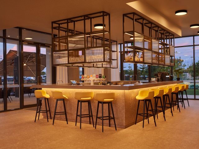 Warm lighting creates an inviting atmosphere at Together & Co Bar in Busselton, one of Hilton Hotel Bars.