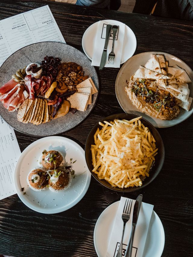 23 street distillery reaturants table full of food