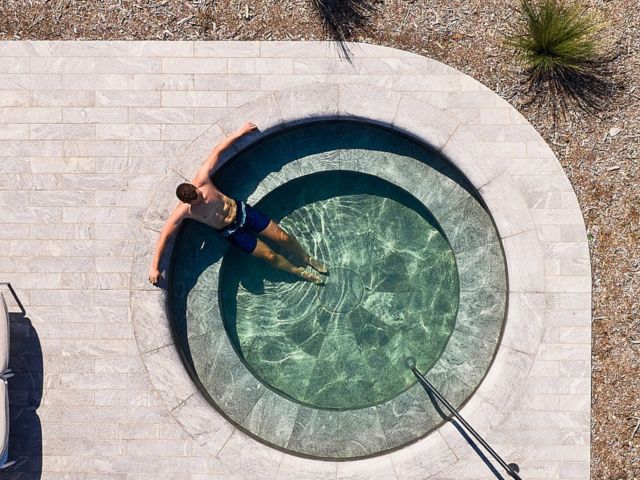 man in pool at Alba Thermal Springs & Spa