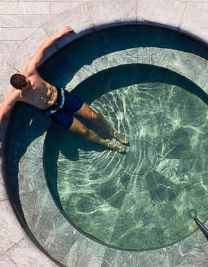 man in pool at Alba Thermal Springs & Spa