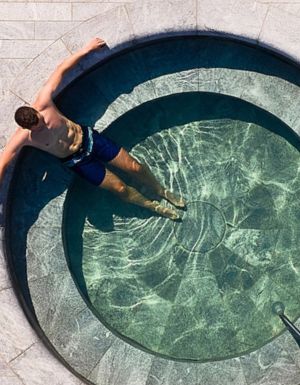 man in pool at Alba Thermal Springs & Spa