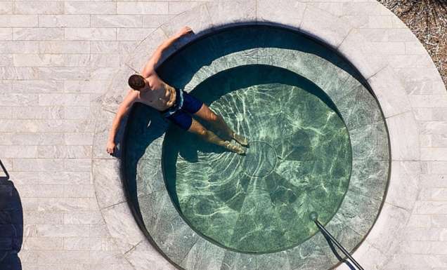 man in pool at Alba Thermal Springs & Spa