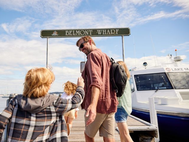 a family walking out onto the old belmont wharf