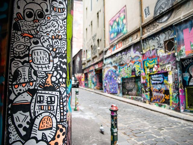 Colourful street art lining Hosier Lane, a vibrant highlight of the ultimate Melbourne weekend.