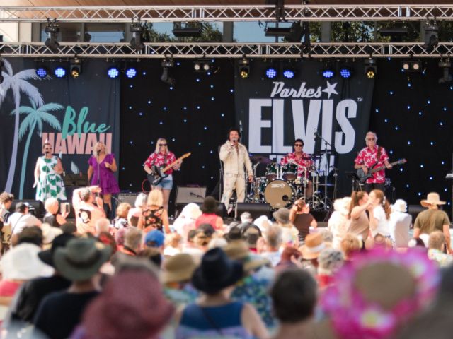 elvis presley impersonator performing on stage at the Parkes Elvis Festival