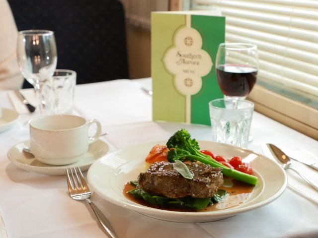 a meal in the dining carriage of vintage rail journeys train