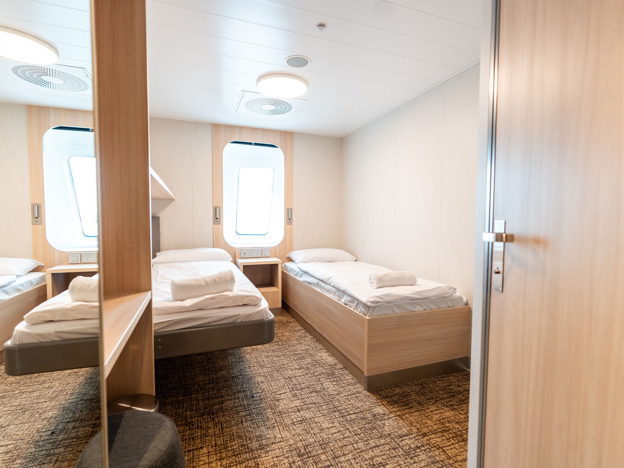 Single beds inside family cabins.
