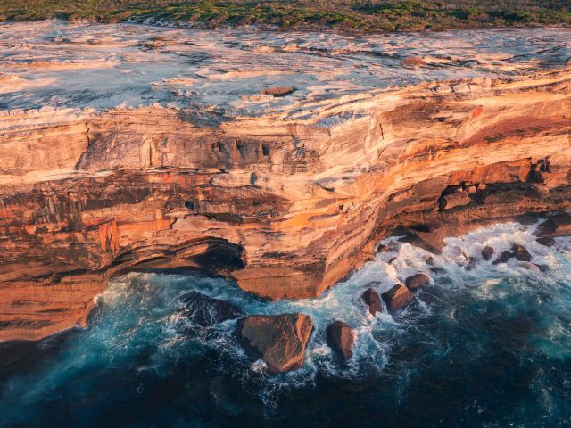 Sandstone cliff walls lining the Kamay Botany Bay National Park, Kurnell