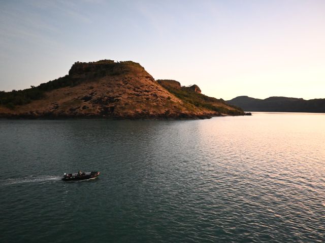 A Zodiac on the water at first light