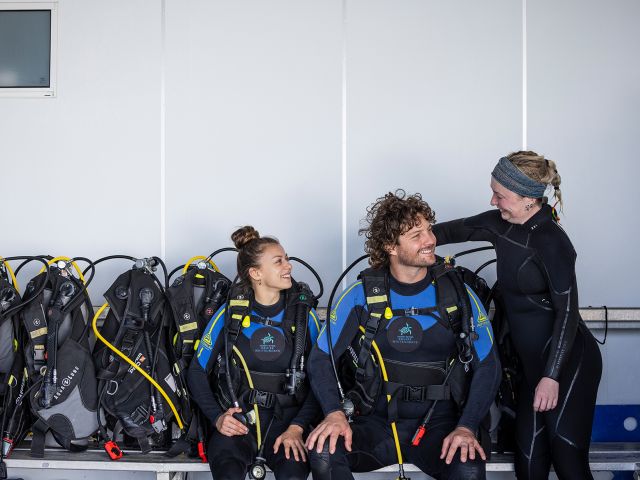 tour leader preparing scua diving gear at cruise whitsunday reefworld