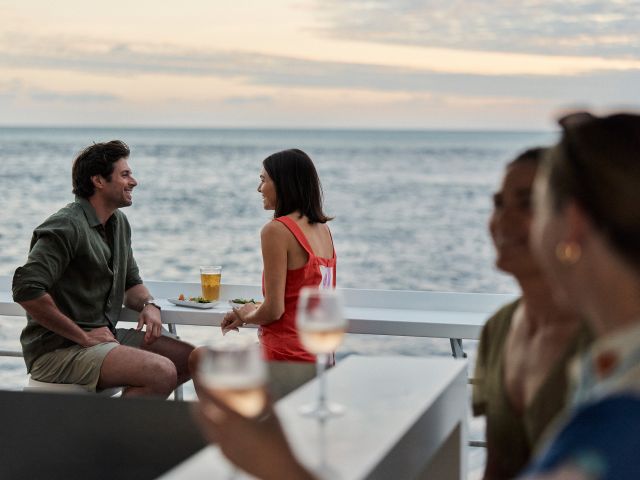 cruise whitsunday reefworld guests enjooying sunset canapes